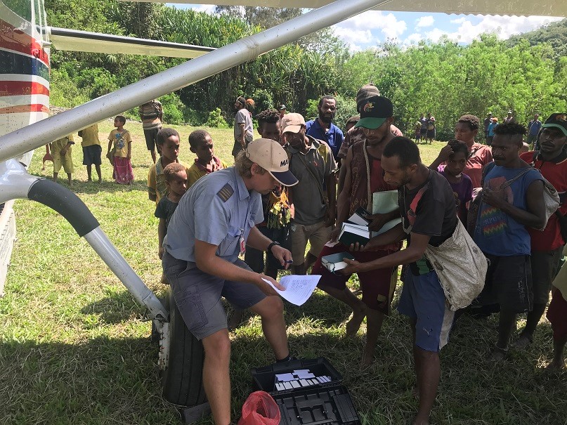 Richie Axon with PNG villagers