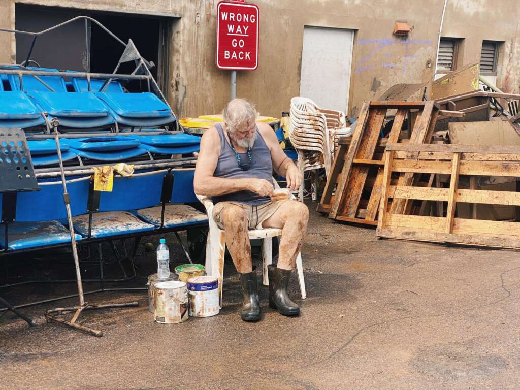 Chester Carter takes a break during flood clean up at Centre Church Lismore