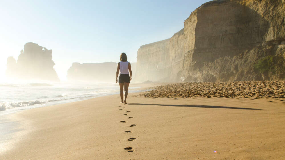 Woman walking on beach