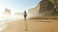 Woman walking on beach