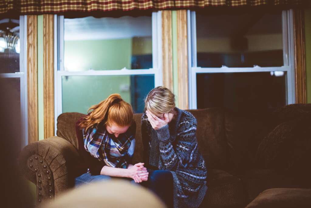 Women praying together