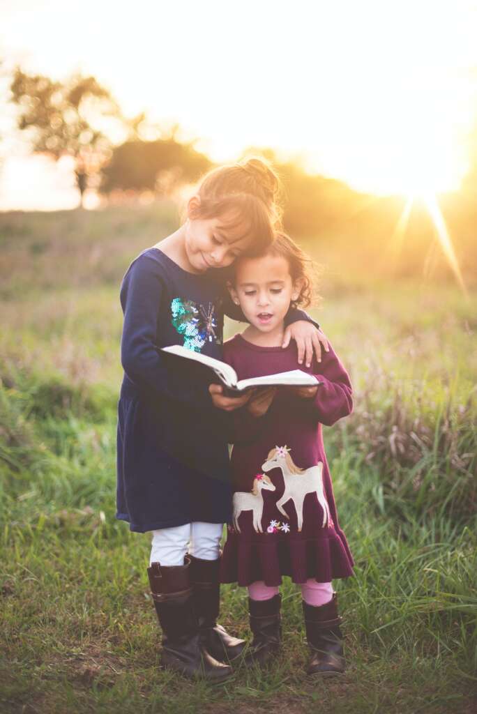 Godparent gives children Bible