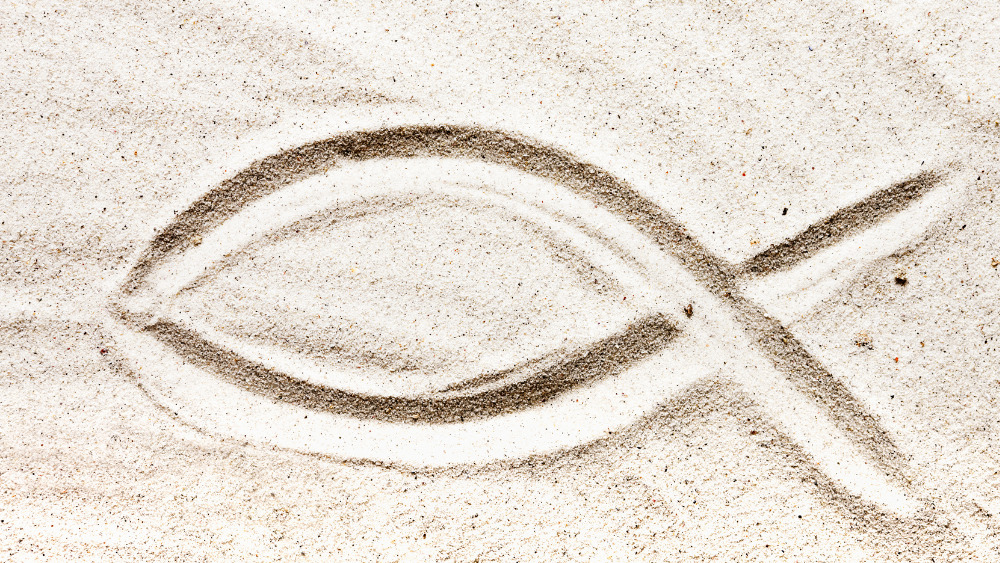 Fish symbol in the sand