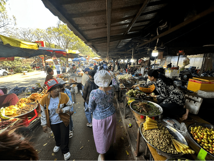 Alan and Leanne Purvis walking through a maze of food.