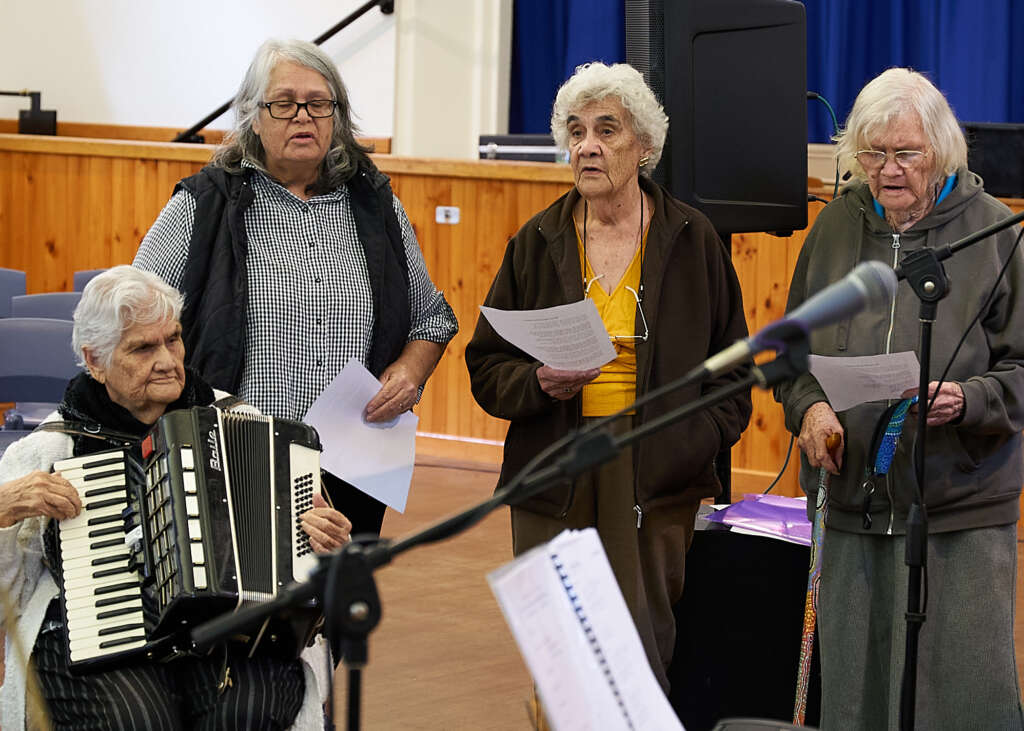 Ladies from Gilgandra share an item